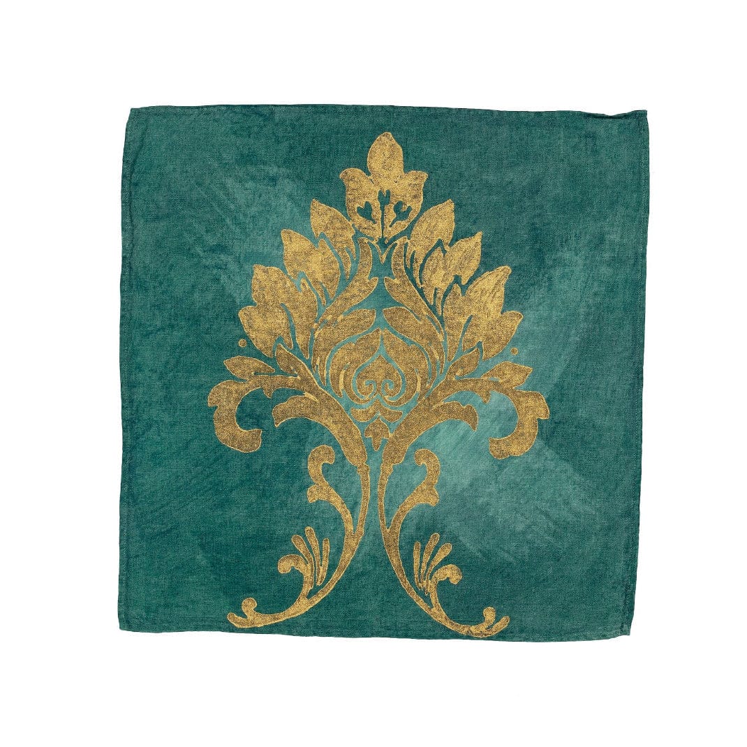 Green fabric with gold floral pattern on a white background