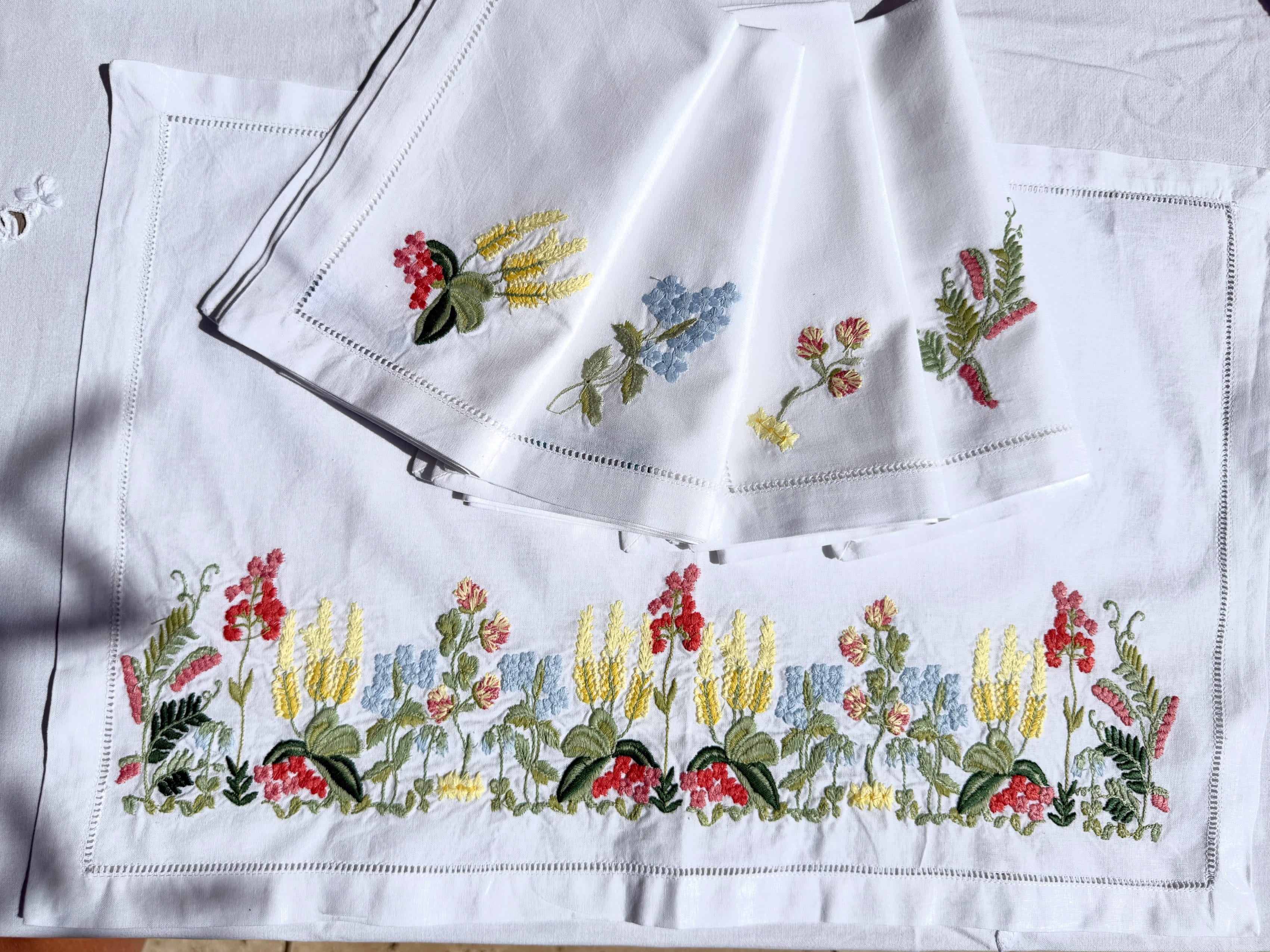 Embroidered floral patterns on white fabric
