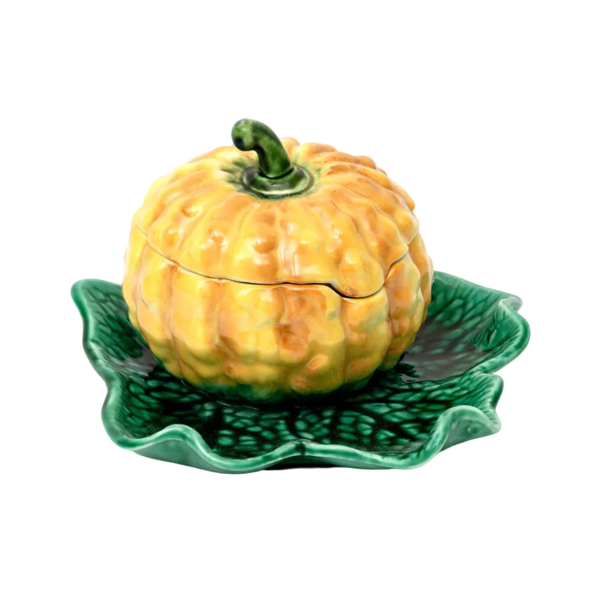 Ceramic pumpkin-shaped container with a green leaf-shaped base on a white background