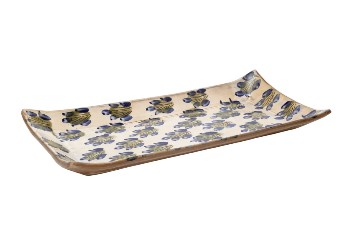 Ceramic tray with floral pattern on a white background