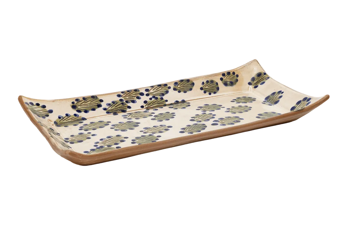 Ceramic tray with floral pattern on a white background