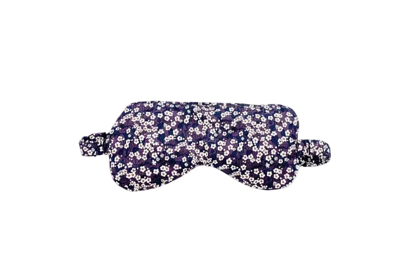 Floral patterned eye mask on a white background