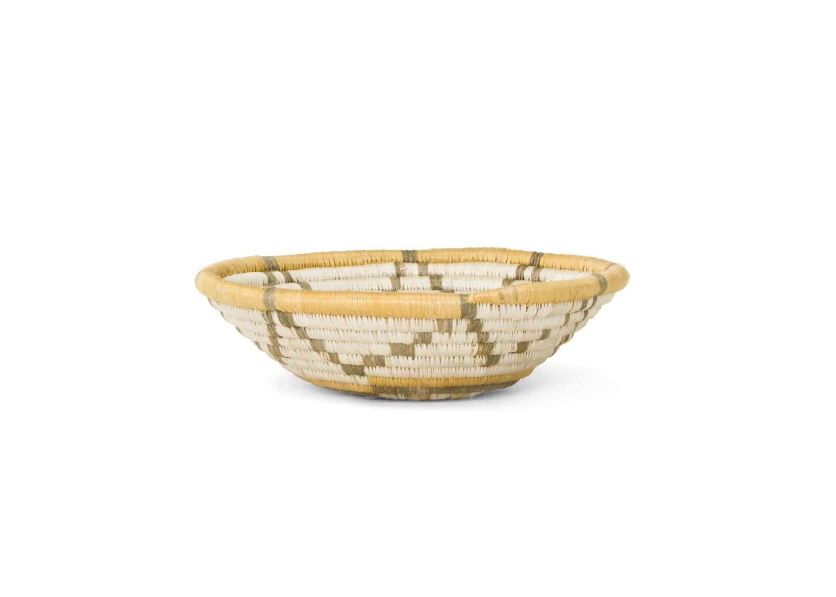 Woven basket with natural and beige pattern on a white background