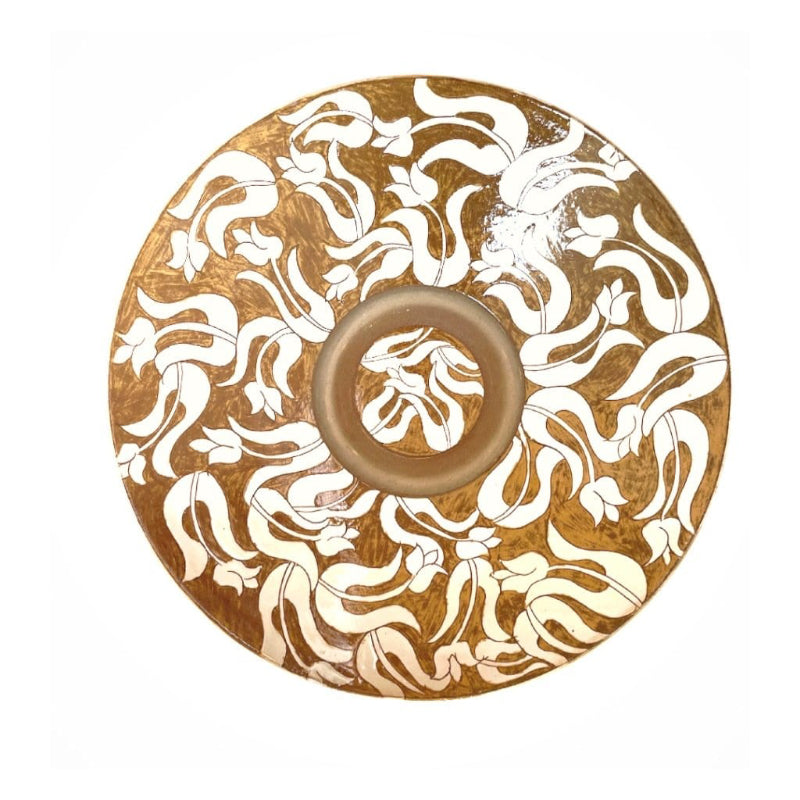 A large ceramic bowl with geometric motifs in beige, gold, and white colors on a white background.