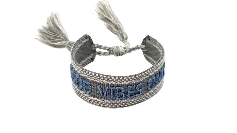Gray braided bracelet with 'Good Vibes Only' text on a white background