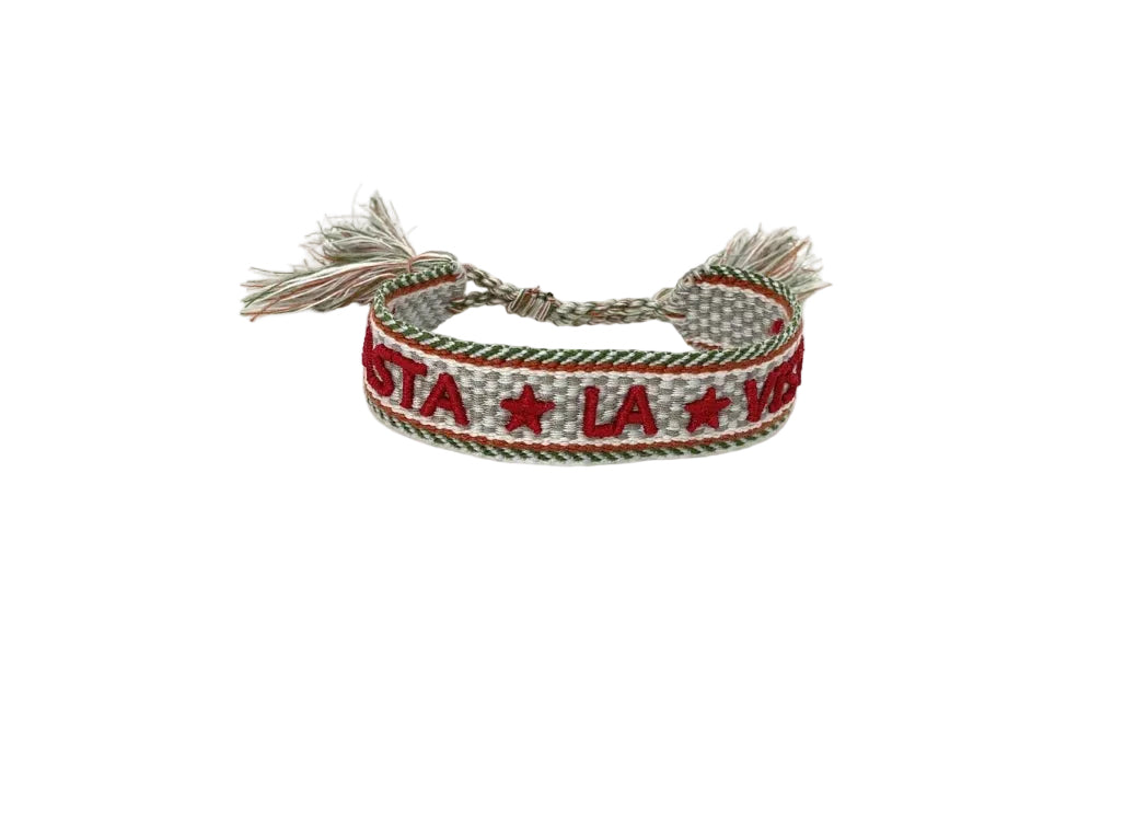 Bracelet with 'Vista La Vida' text and star design on a white background