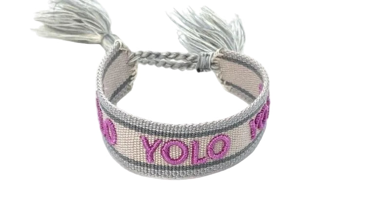 Bracelet with 'Yolo' text on a white background