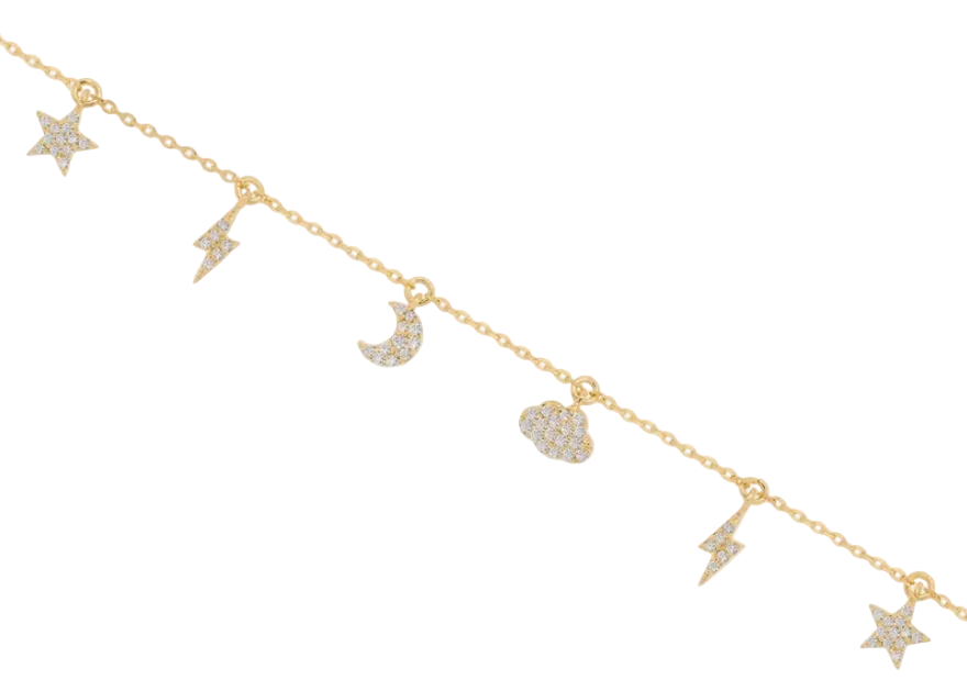 Gold necklace with star, moon, and heart charms on a white background
