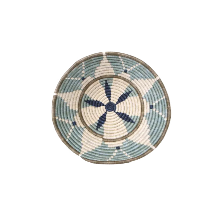 Woven basket with blue and white pattern on a white background