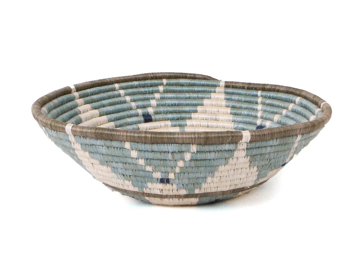 Woven bowl with blue and brown pattern on a white background