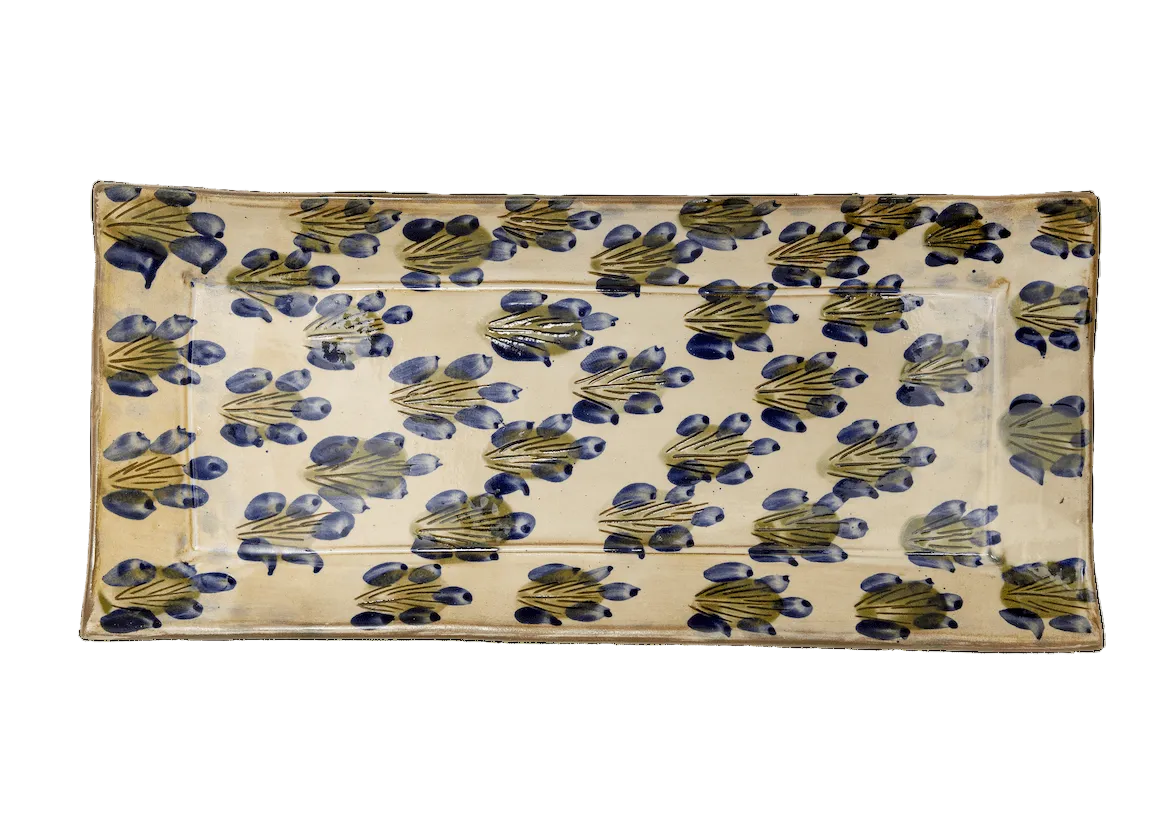 Rectangular fabric with blue and green floral pattern on a beige background