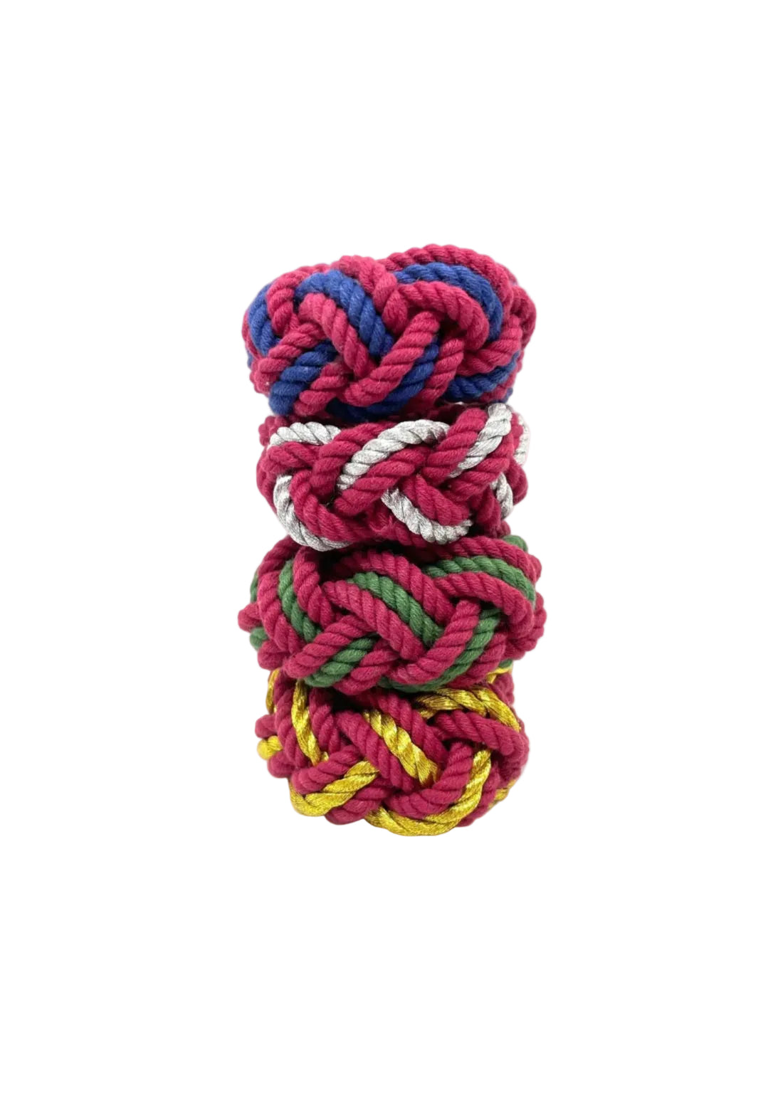 A stack of colorful handwoven cotton napkin rings in red, blue, green, and yellow.