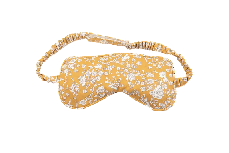 Yellow floral sleep mask with decorative headband on a transparent background