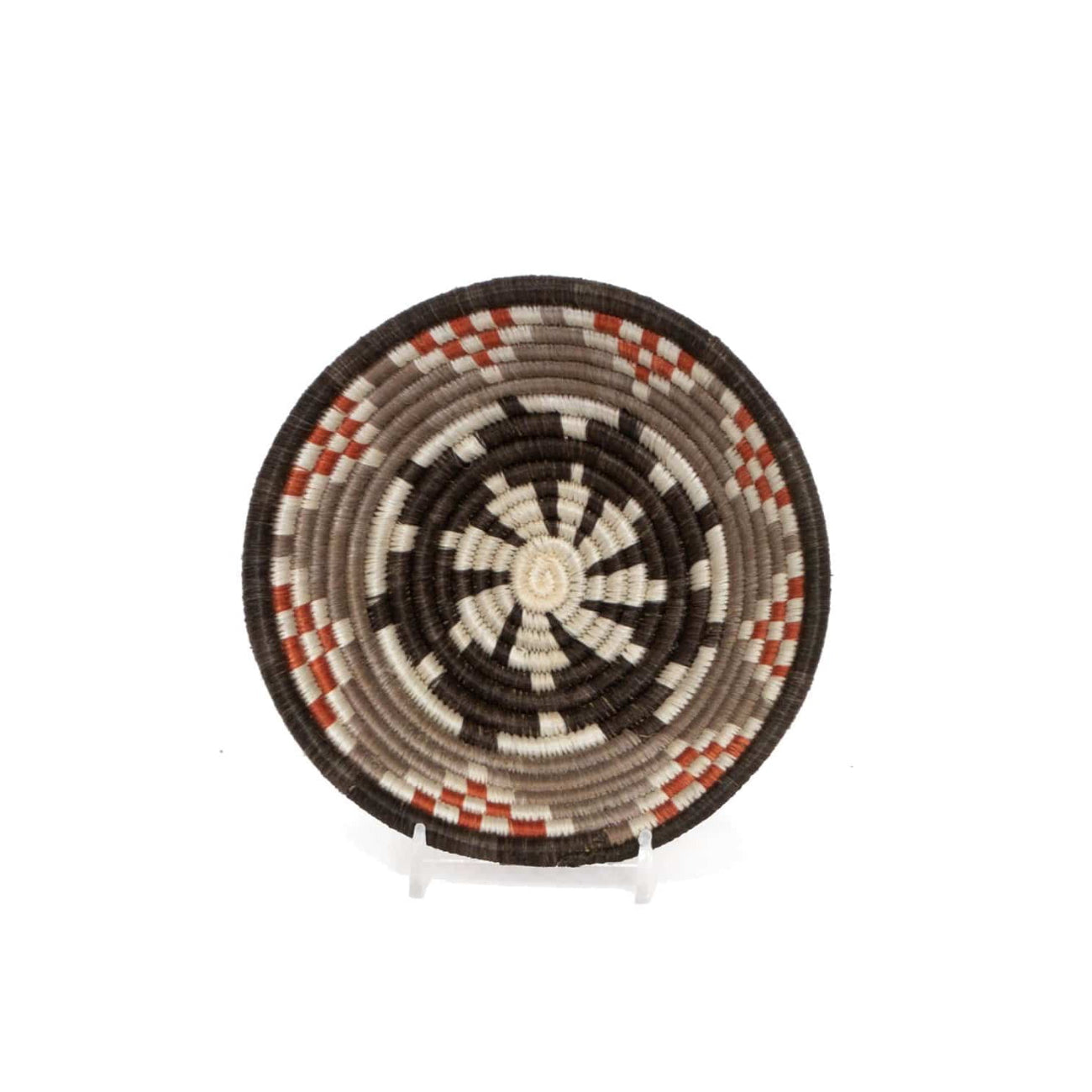 Woven basket with a circular pattern on a white background