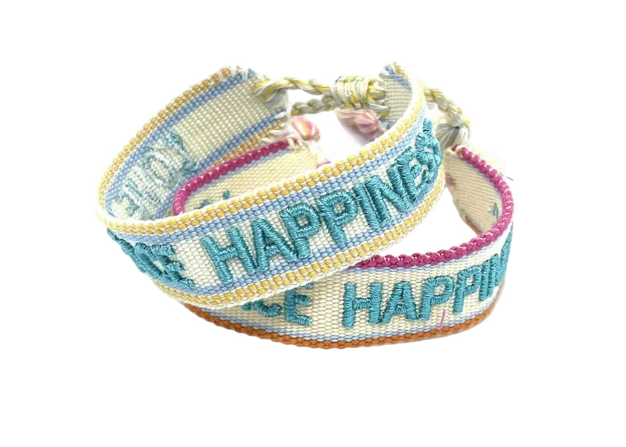 A collection of woven cotton friendship bracelets with various texts including 'LOVE', 'PEACE', and 'HAPPINESS'.