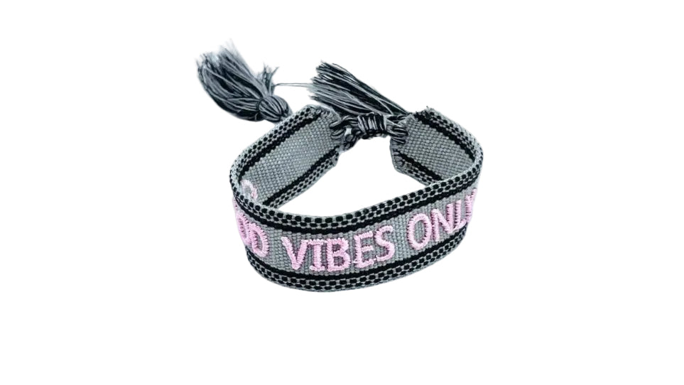 Gray bracelet with pink text on a white background